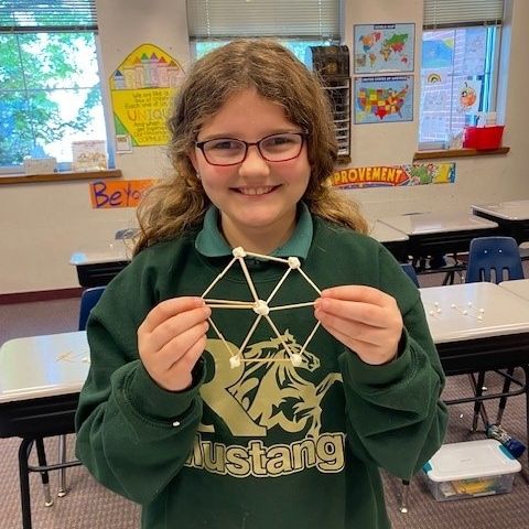 Three students working together one a worksheet