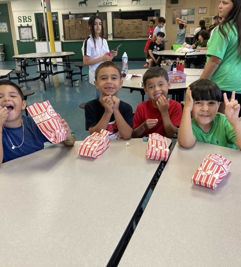 Students eating a popcorn snack